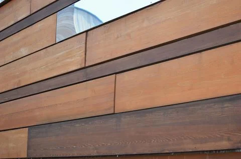 Decorative rectangular brown planks, wood and mirror panels in abstract pat.. Stock Photos