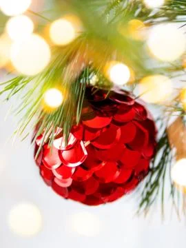 Decorative red ball with scale spangles for Christmas tree. Colorful decorati Stock Photos