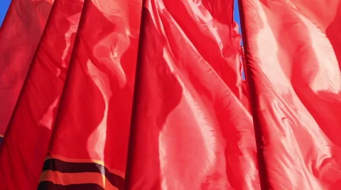 Decorative red flags waving in wind Stock Footage 54686393