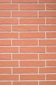 Decorative relief cladding slabs imitating bricks on wall 库存照片