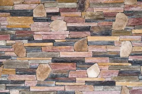 Decorative relief cladding slabs imitating stones on wall Foto stock