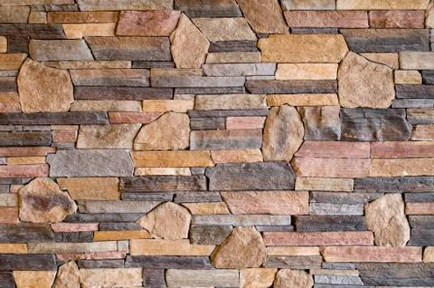Decorative relief cladding slabs imitating stones on wall Foto stock