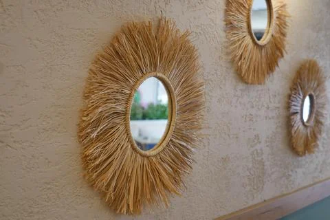 Decorative round mirrors on a wall in a cafe setting Stock Photos