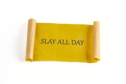 A decorative scroll made of yellow paper unfurls to reveal the bold phrase Stock Photos