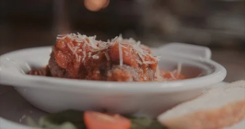 Decorative shot of meatballs with slice of bread and salad Stock Footage 105303531