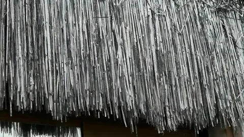 Decorative silver shiny tinsel in the wind 스톡 동영상 337359324
