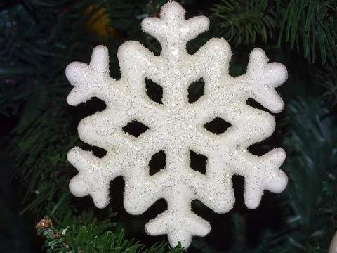 Decorative snowflake on a Christmas tree Stock Photos