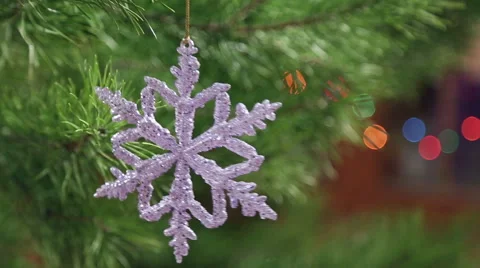 Decorative snowflake hanging on a Christmas tree Stock Footage 58450229