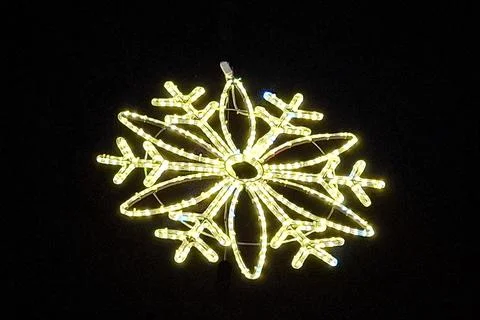 Decorative snowflake made of lights Фото