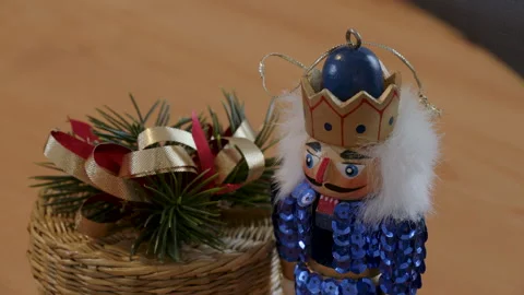 Decorative sparkly nutcracker and small Christmas wicker basket Stock Footage 295921764