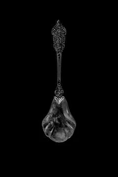 Decorative spoon on a dark background. the view from the top Stock Photos