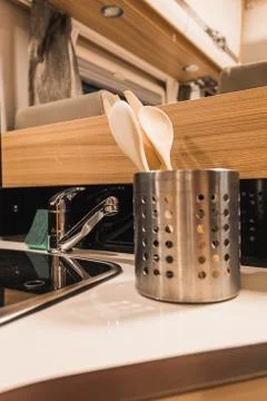 Decorative spoons in the kitchen of a caravan Stock Photos