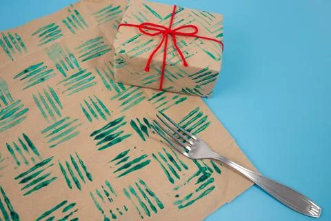 Decorative stamps tutorial with fork in the paint and sheets of paper. Crea.. Stock Photos