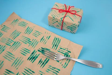 Decorative stamps tutorial with fork in the paint and sheets of paper. Crea.. Stock Photos