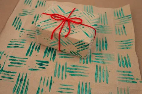 Decorative stamps tutorial using a fork and paint to create unique wrapping.. Stock Photos