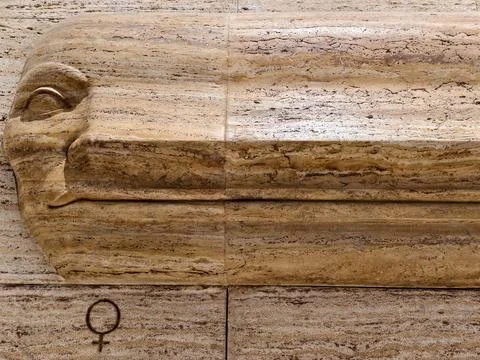 Decorative stone details, travertine panel with symbols, relief carving fea.. Stock Photos