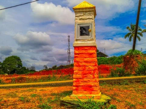 A decorative stone pillar with a mailbox inside Stock Photos