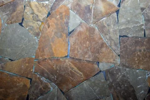 Decorative stone wall cladding, building masonry,  texture and background Stock Photos