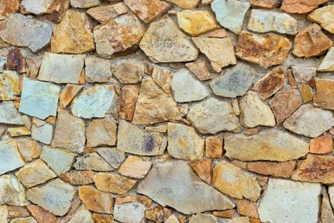 Decorative stone wall, Cobble texture with cracks Stock Photos