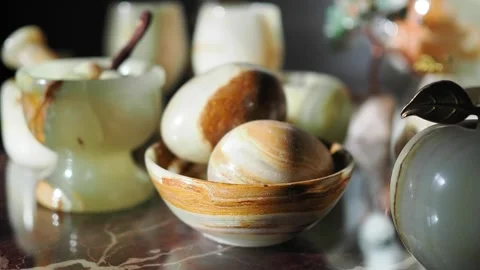 Decorative stones and objects on a table display Stock Footage 340375882