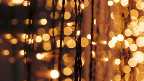 Decorative string lights hang and glow, vintage garland of lamps, warm lighting Video stock 137724031