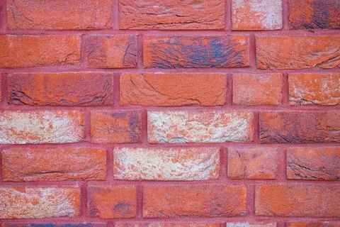 Decorative structural brick wall painted red. Foto stock
