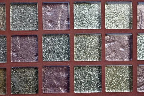 Decorative surface made of multi-colored squares of tiles Stock Photos