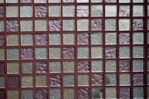 Decorative surface made of multi-colored squares of tiles Stock Photos