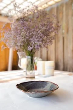 Decorative table setting with beautiful dishes and flowers Stock Photos