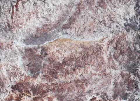 Decorative texture of the wall under the stone Stock Photos