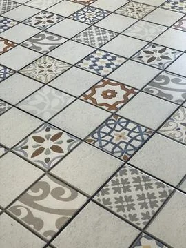 Decorative tile floor with various patterns and designs Stock Photos