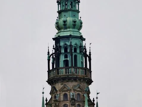 Decorative tower with detailed ironwork. Vertically aligned ornate copper s.. 스톡 사진
