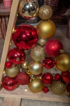 Decorative triangular Christmas tree of boards with balls 写真素材