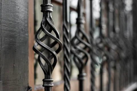Decorative, twisted window bars Stock Photos