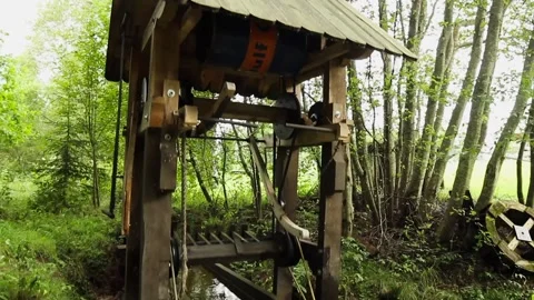 Decorative useless mechanical bird wings moving mechanism moved by falling water Stock Footage 248846960