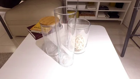 Decorative vase on white table. Stock Footage 79191363