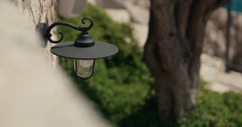 Decorative Wall Lantern on Stone Building Stock-Footage 336932446