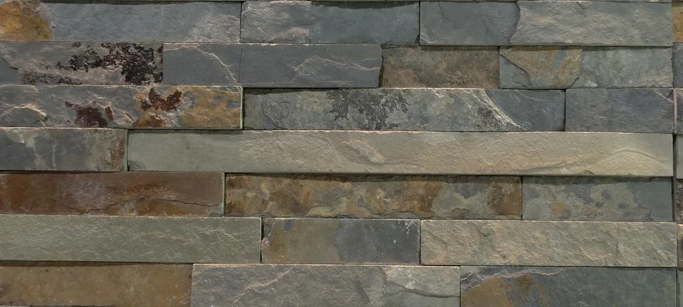 Decorative wall made of rectangular stone Stock Photos
