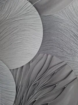 Decorative wall panel featuring overlapping circular shapes and flowing tex.. Foto stock