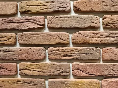 Decorative wall panels featuring brick stone and tile finishes displayed in.. Stock Photos