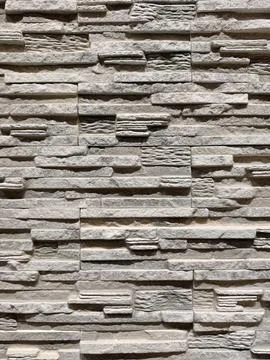 Decorative wall panels replicating brick stone and tile finishes arranged i.. Stock Photos