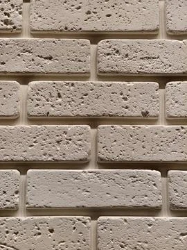 Decorative wall panels replicating brick stone and tile finishes shown in a.. Stock Photos