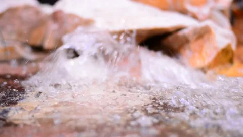Decorative water source at city mall with stones and light. Stock Footage 83444724