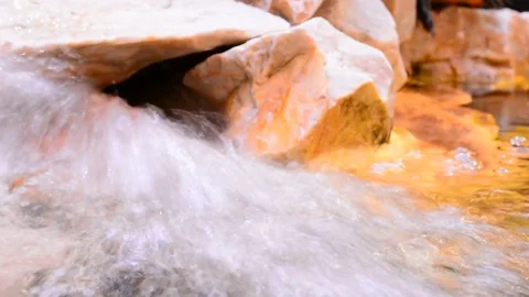 Decorative water source at city mall with stones and light. Stock Footage 83445013
