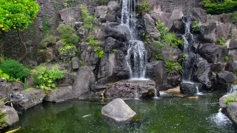 Decorative waterfall at pond of Spirited garden in Jeju island, South Korea. Stock Footage 278385451