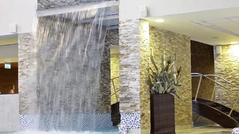 Decorative waterfall - water falls down Video stock 73123795