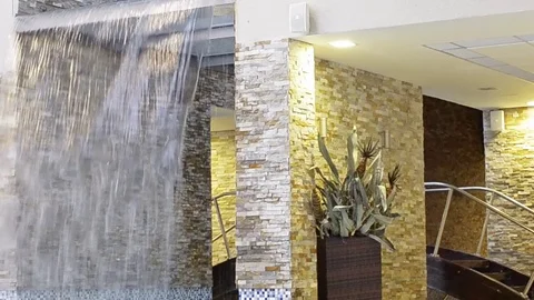 Decorative waterfall - water falls down Stock Footage 73123915
