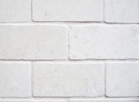 Decorative white cladding slabs imitating stones on wall Foto stock