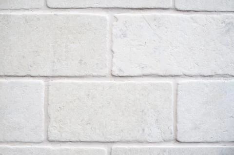 Decorative white cladding slabs imitating stones on wall Foto stock