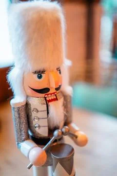 Decorative White Nutcracker With White Fur Bearskin Hat a Silver Costume an.. Stock Photos